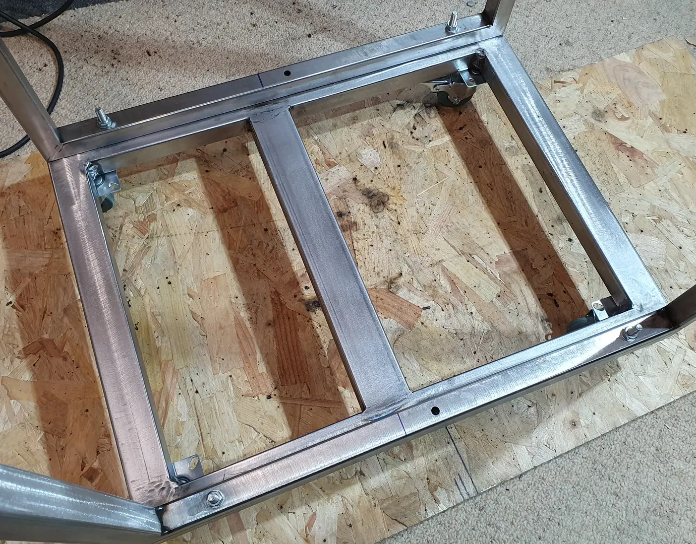 Steel cross member welded into position